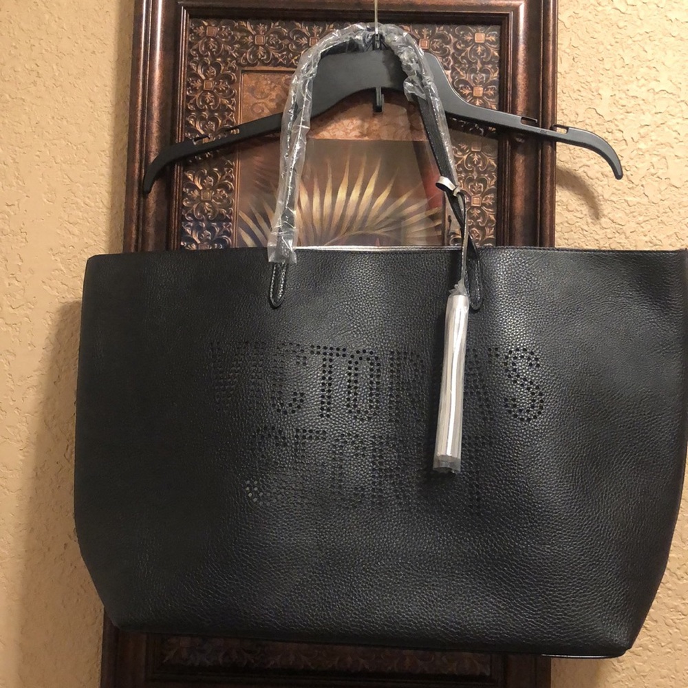 NWT Victoria’s Secret Tote Bag with silver tassel & silver lining.  Plastic wrap